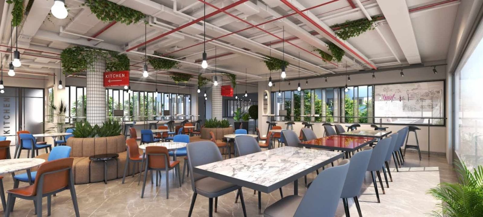 Green cafeteria space with plants and communal tables